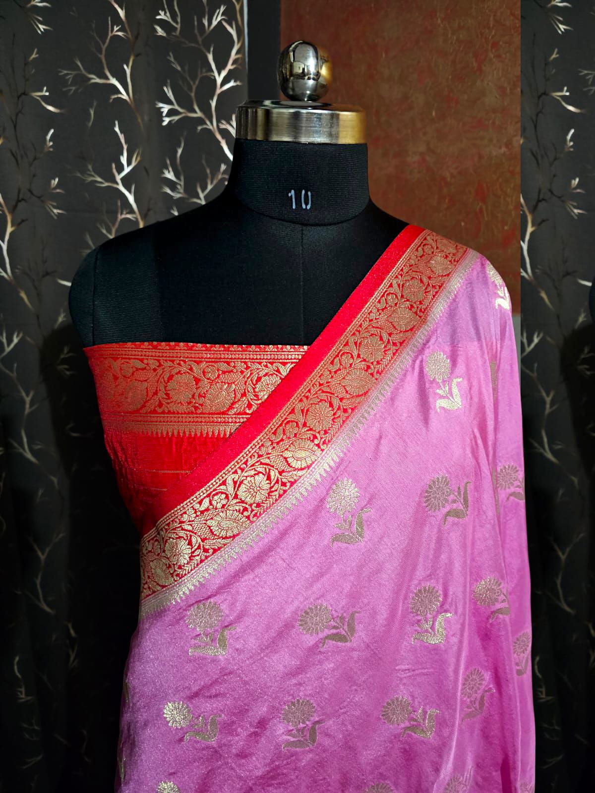 "Classic pink silk saree with delicate floral weaving and festive elegance"