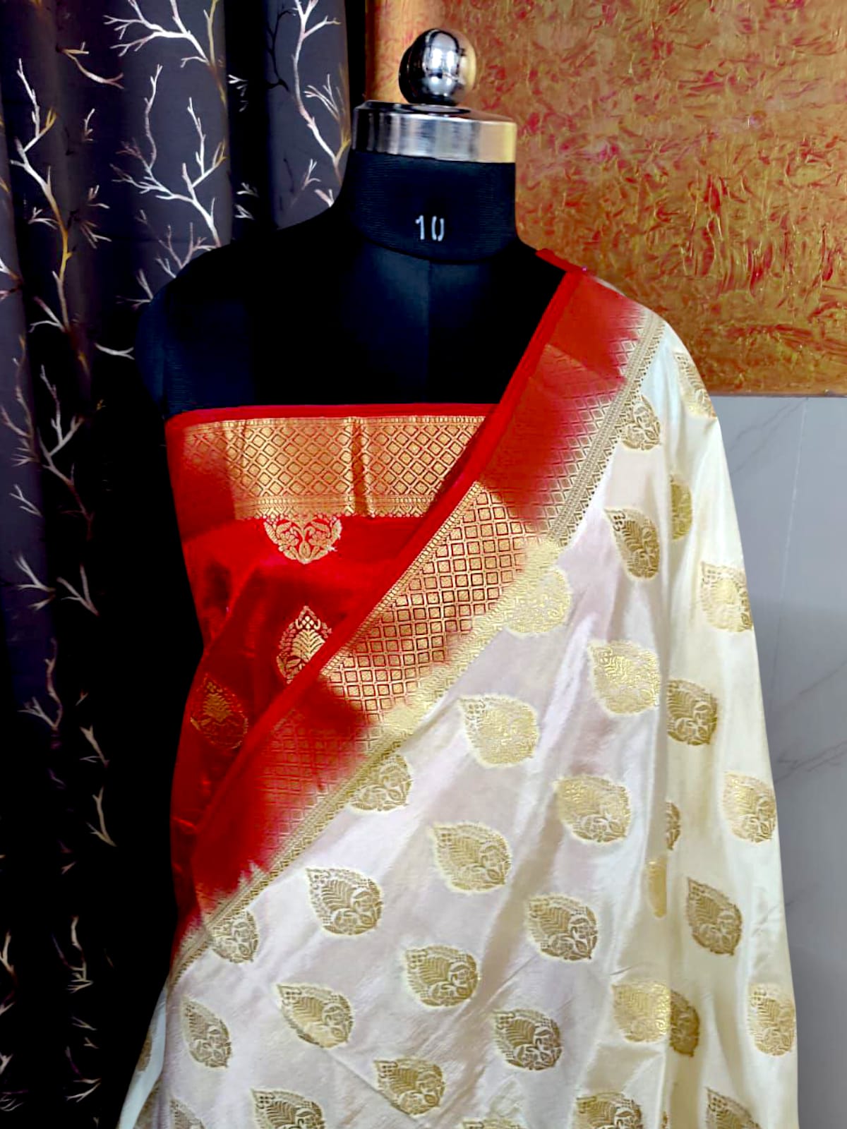"Luxury Bengali silk saree with delicate floral patterns and rich pallu"