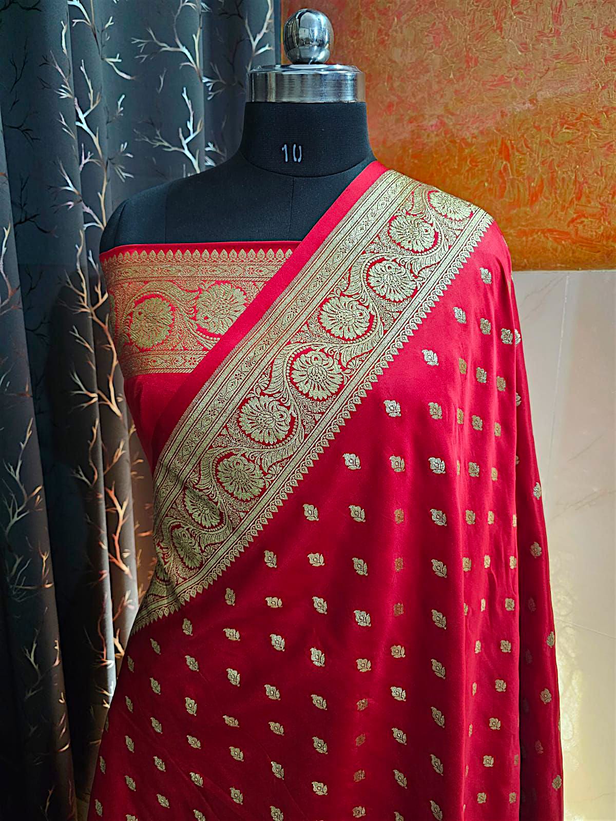 "Red bridal Banarasi saree in Katan silk with grand zari weaving and designer blouse piece"