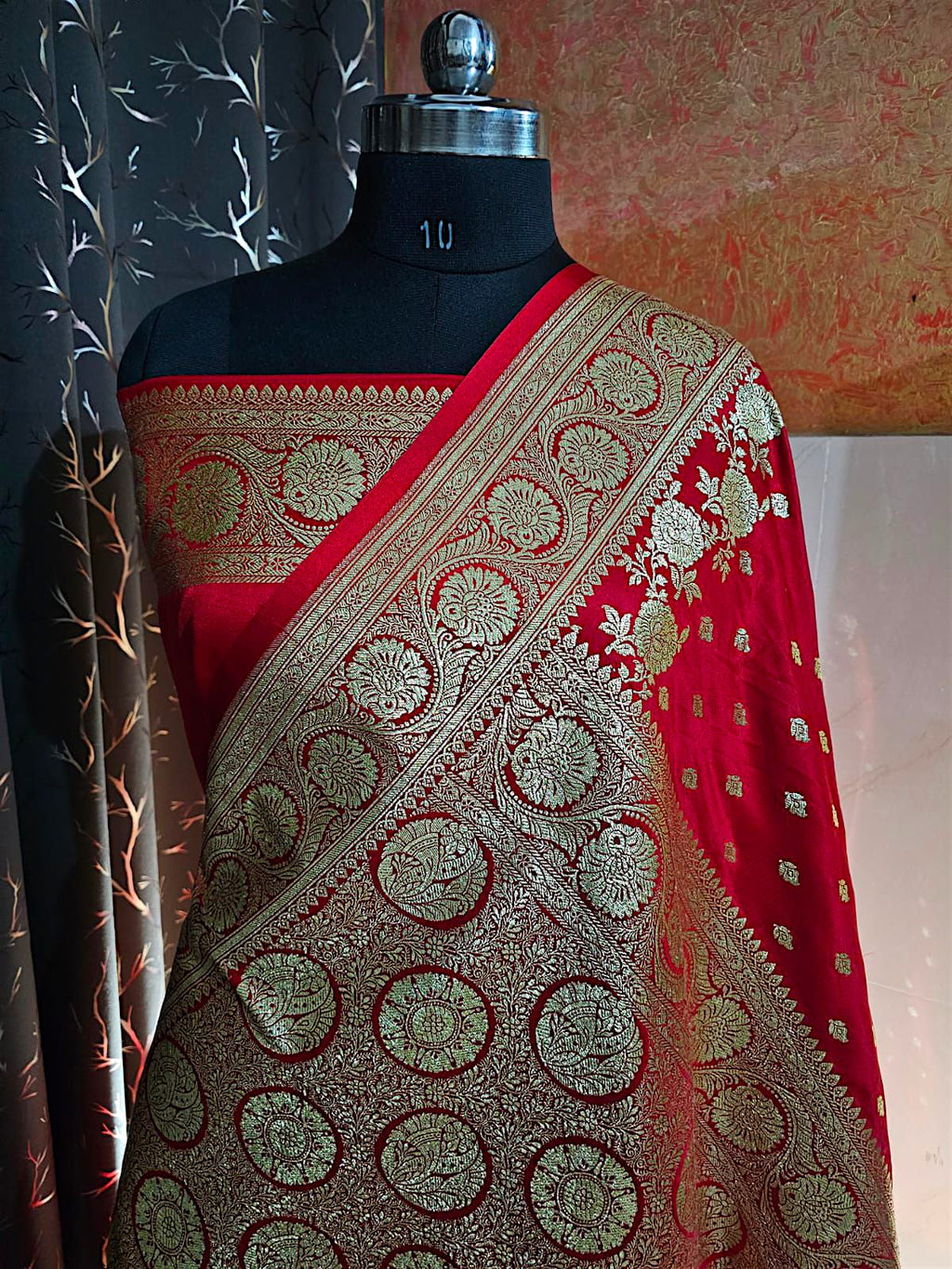 Traditional red Banarasi silk saree with antique gold border and pallu"