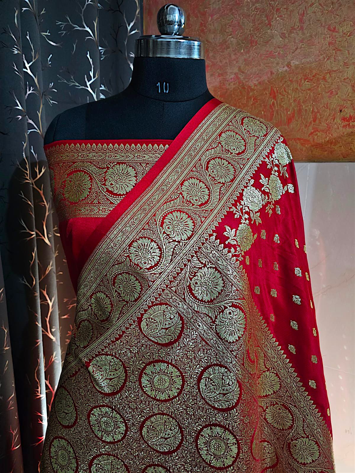 Traditional red Banarasi silk saree with antique gold border and pallu"