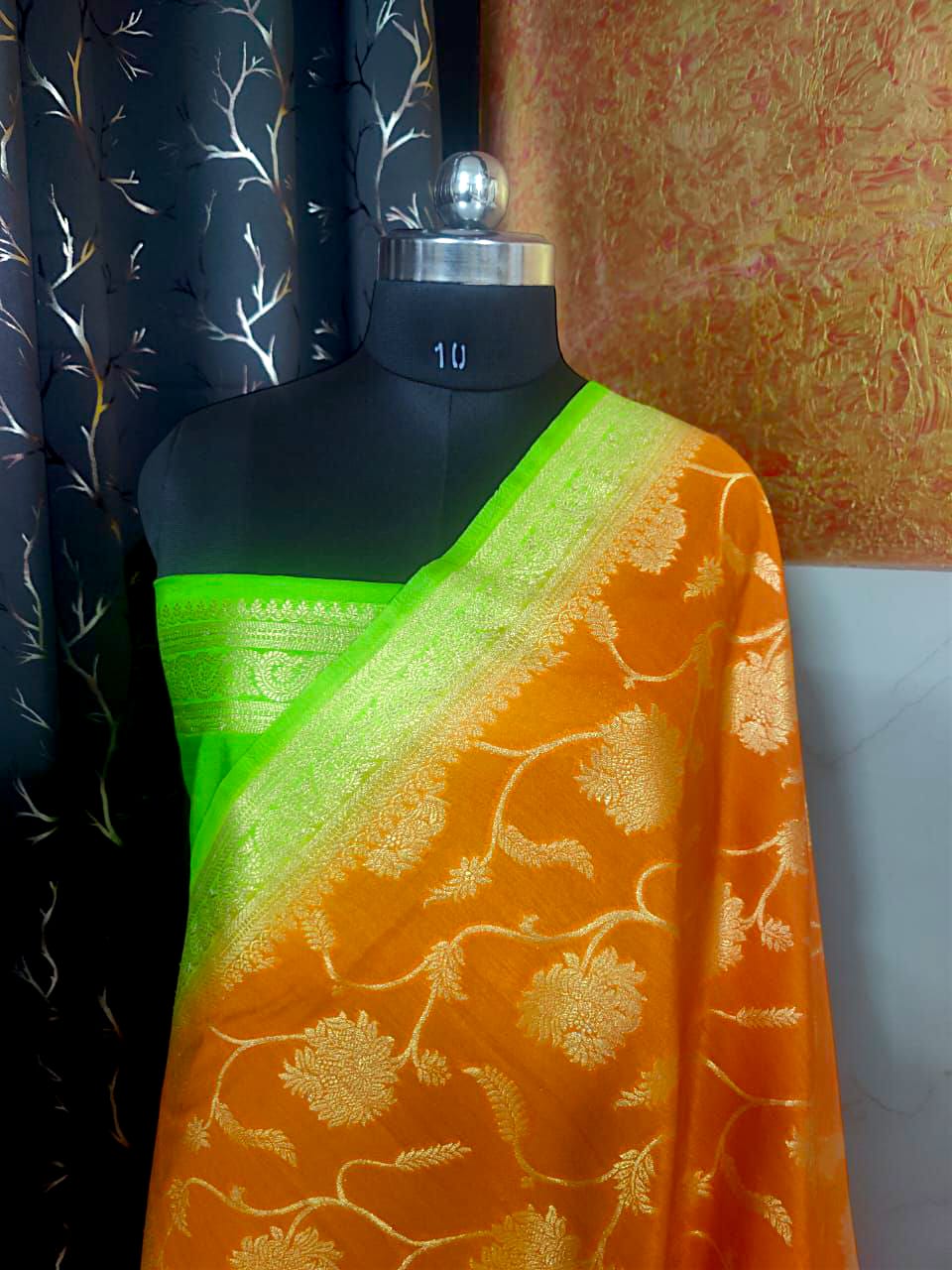 orange silk saree with golden zari border and intricate pallu design"