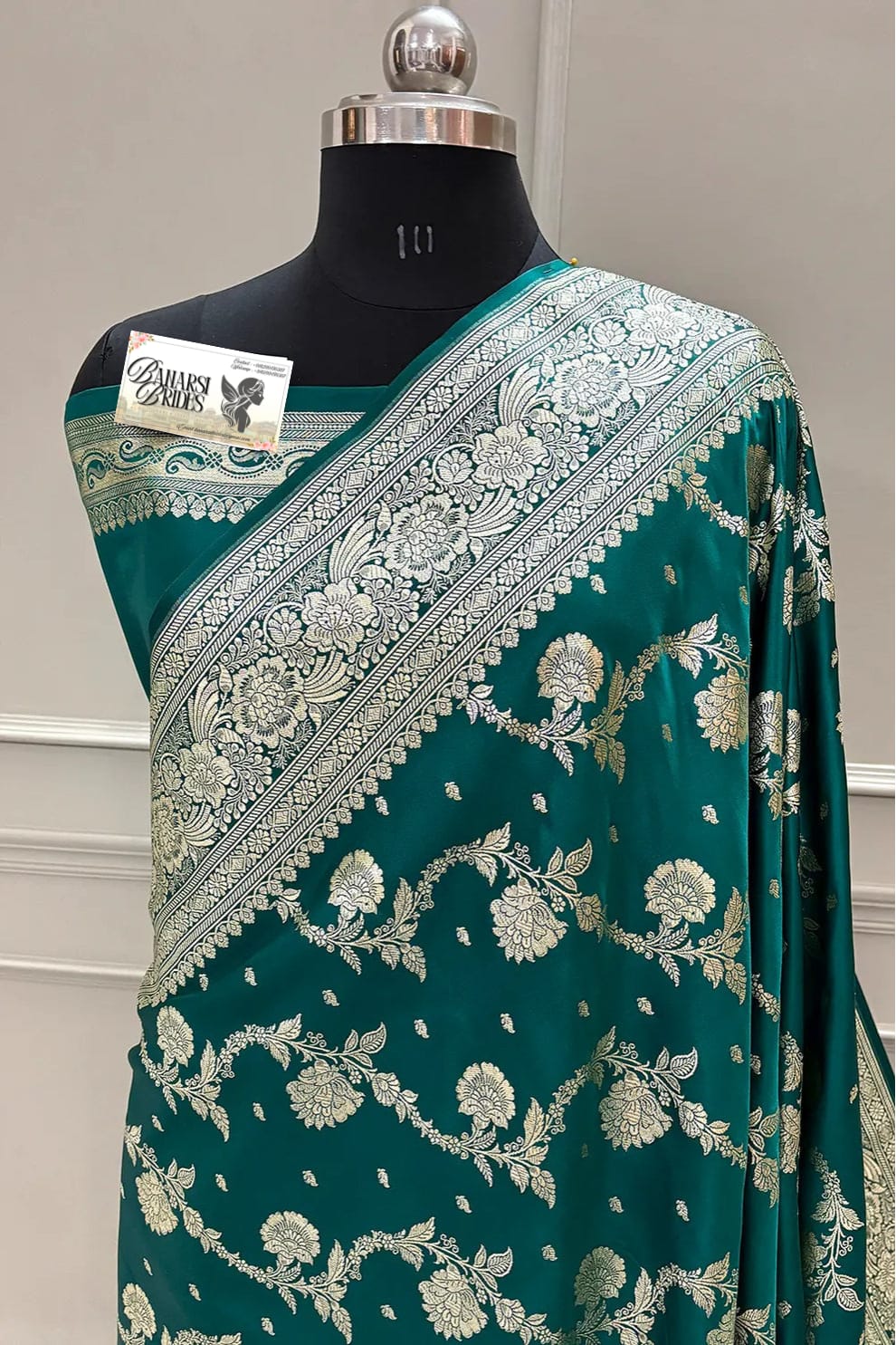 "Teal Banarasi Katan silk saree with Tirchi Daal weaving and intricate golden zari border"