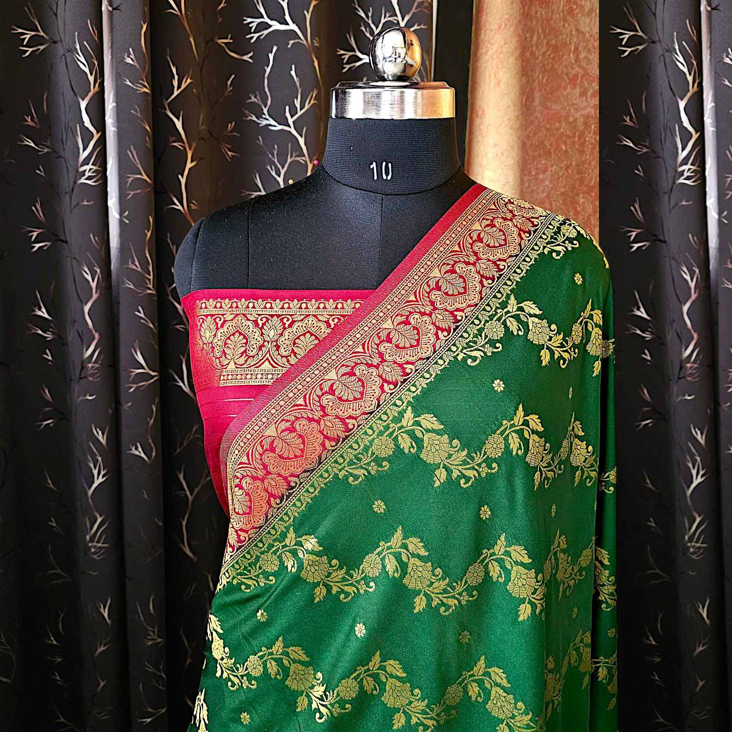 “Green dupion silk saree with contrasting red border, traditional festive wear”