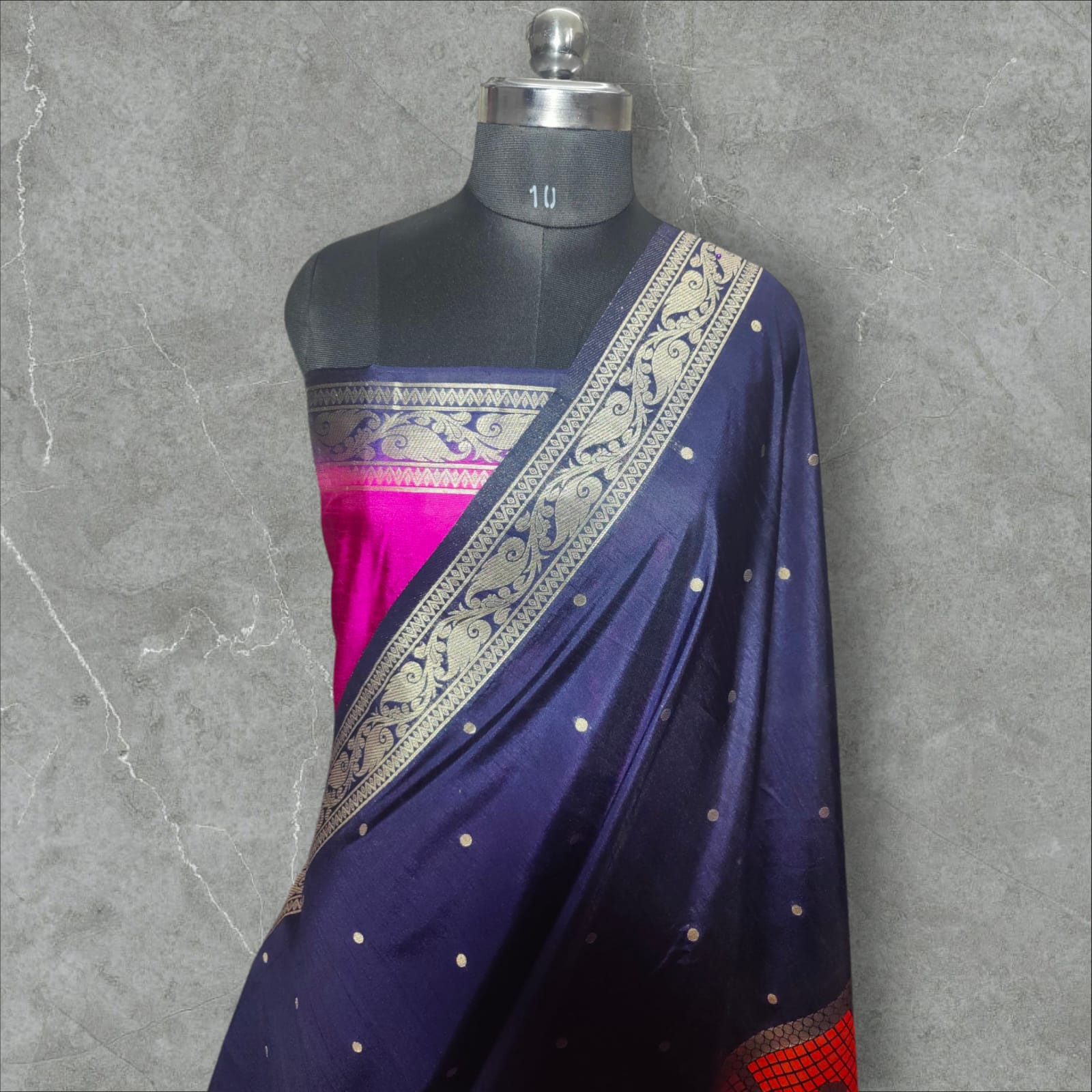 "Stunning Dupion Silk Saree with a vibrant navy blue and pink contrast, featuring intricate golden zari weaving, a checkered multi-color pattern, and a richly designed broad border, perfect for festive and traditional occasions."