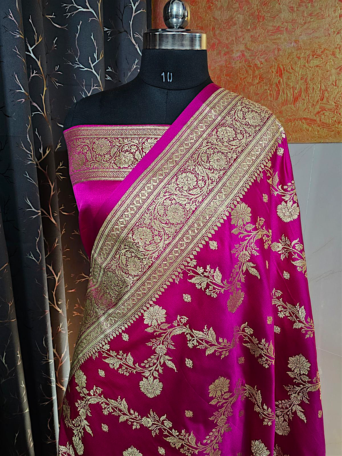 "Rani color bridal Banarasi saree with heavy golden zari border and rich pallu"