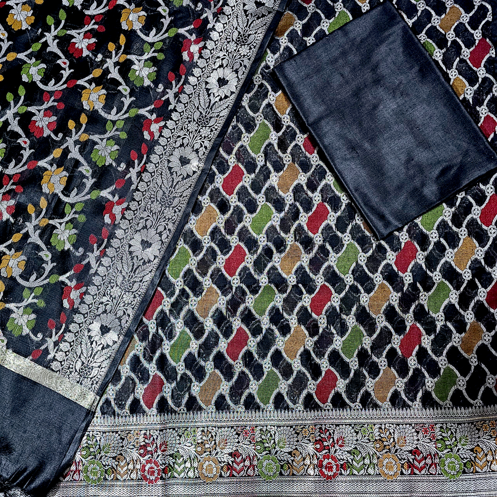 "Black Banarasi silk suit with rich golden zari work, traditional handloom weaving, and elegant festive wear design for weddings and special occasions."