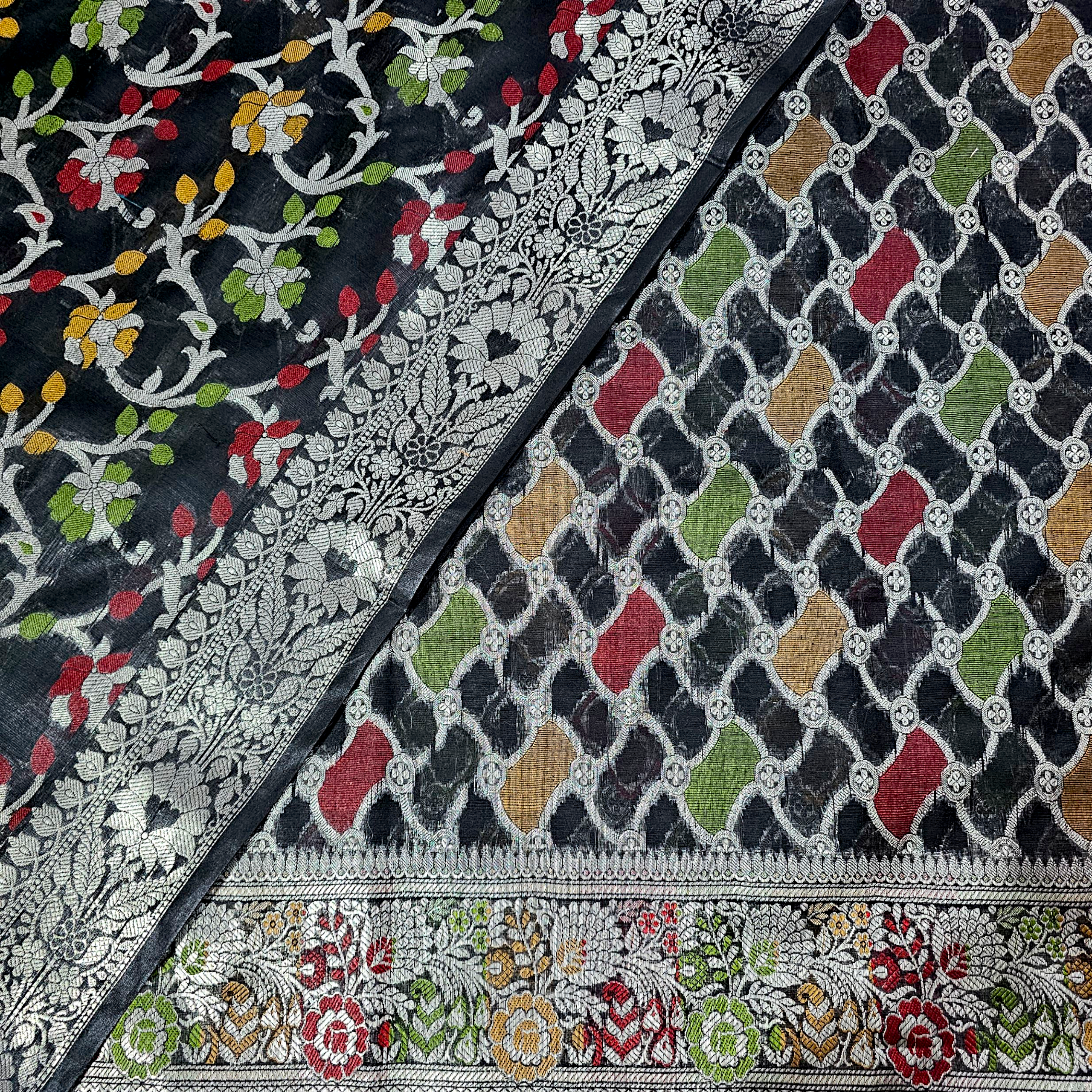 Elegant black Banarasi silk suit with intricate silver zari weaving, luxurious handloom fabric, and timeless design for weddings, parties, and festive occasions."